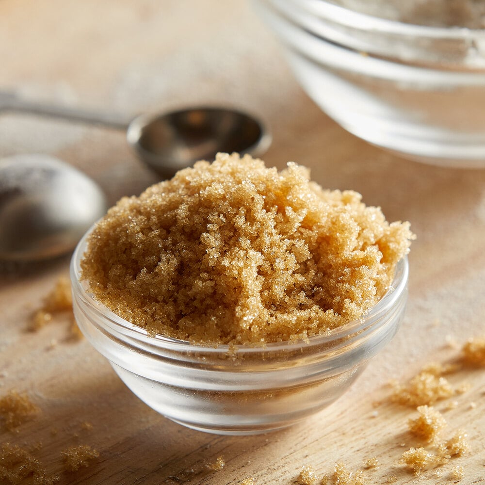 Wooden spoon filled with a scoop of powdered sugar