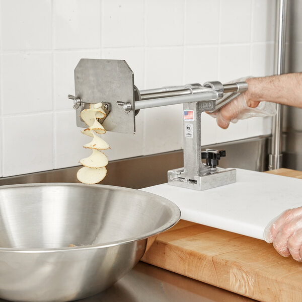red onion being diced on a food cutter