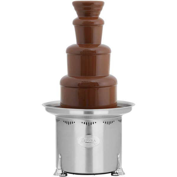 A Sephra Montezuma chocolate fountain on a stand on a table.